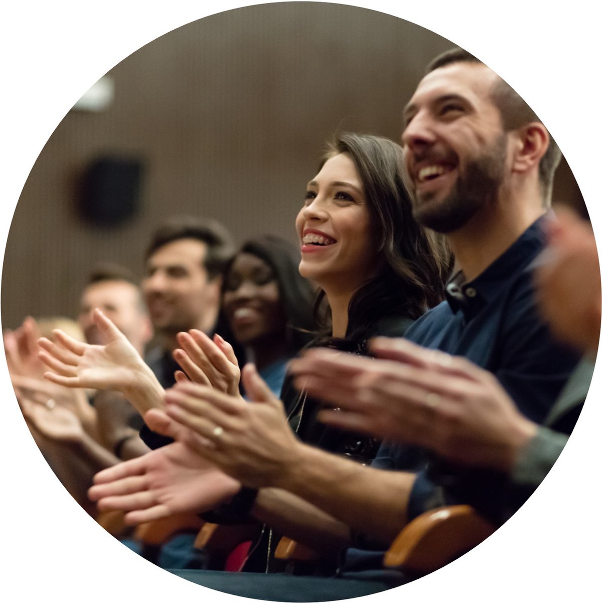 Audience applauding, fully engaged and present